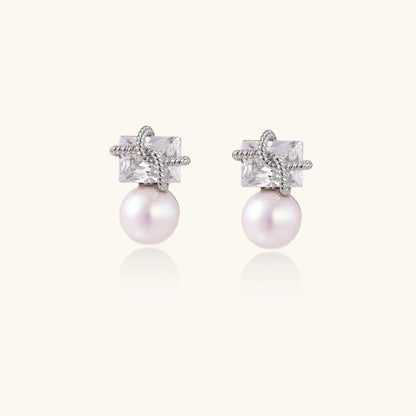 White gold stud earrings with square crystal stones in twisted frames and pink freshwater pearl drops below